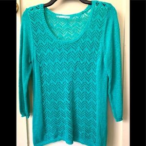 Beautiful knitted “over” sweater. Overlapping opening in back.